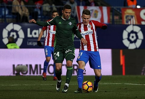 Football Soccer- Atletico Madrid v Real Betis - Spanish La Liga Santander - Vicente Calderon stadium, Madrid, Spain, 14/01/17 Atletico Madrid's Kevin Gameiro (R) and Real Betis' Riza Durmisi in action.  REUTERS/Sergio Perez