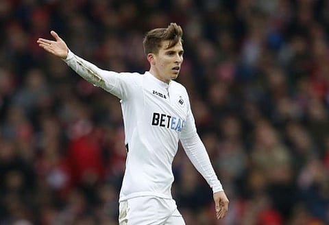 Tottenham fans react on Twitter to Carroll display for Swansea