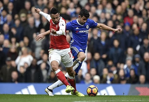 Britain Football Soccer - Chelsea v Arsenal - Premier League - Stamford Bridge - 4/2/17 Arsenal's Francis Coquelin in action with Chelsea's Diego Costa  Reuters / Hannah McKay Livepic EDITORIAL USE ONLY. No use with unauthorized audio, video, data, fixture lists, club/league logos or "live" services. Online in-match use limited to 45 images, no video emulation. No use in betting, games or single club/league/player publications.  Please contact your account representative for further details.