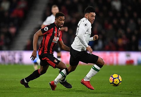Soccer Football - Premier League - AFC Bournemouth vs Liverpool - Vitality Stadium, Bournemouth, Britain - December 17, 2017   Liverpool’s Alex Oxlade-Chamberlain in action with Bournemouth's Jordon Ibe    REUTERS/Dylan Martinez    EDITORIAL USE ONLY. No use with unauthorized audio, video, data, fixture lists, club/league logos or "live" services. Online in-match use limited to 75 images, no video emulation. No use in betting, games or single club/league/player publications.  Please contact your account representative for further details.