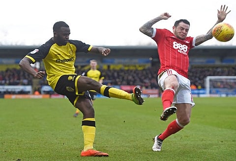 Soccer Football - Championship - Burton Albion vs Nottingham Forest - Pirelli Stadium, Burton-on-Trent, Britain - February 17, 2018  Burton's Lucas Akins in action with Nottingham Forest's Lee Tomlin   Action Images/Alan Walter  EDITORIAL USE ONLY. No use with unauthorized audio, video, data, fixture lists, club/league logos or "live" services. Online in-match use limited to 75 images, no video emulation. No use in betting, games or single club/league/player publications. Please contact your account representative for further details.