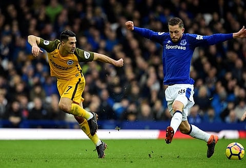 Soccer Football - Premier League - Everton vs Brighton & Hove Albion - Goodison Park, Liverpool, Britain - March 10, 2018   Everton's Gylfi Sigurdsson in action with Brighton's Beram Kayal            REUTERS/Rebecca Naden    EDITORIAL USE ONLY. No use with unauthorized audio, video, data, fixture lists, club/league logos or "live" services. Online in-match use limited to 75 images, no video emulation. No use in betting, games or single club/league/player publications.  Please contact your account representative for further details.