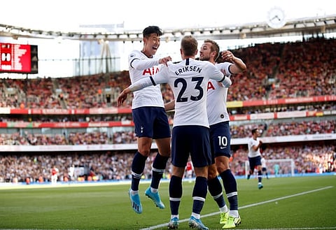 Soccer Football - Premier League - Arsenal v Tottenham Hotspur - Emirates Stadium, London, Britain - September 1, 2019  Tottenham Hotspur's Christian Eriksen celebrates scoring their first goal with teammates Son Heung-min and Harry Kane   REUTERS/David Klein  EDITORIAL USE ONLY. No use with unauthorized audio, video, data, fixture lists, club/league logos or "live" services. Online in-match use limited to 75 images, no video emulation. No use in betting, games or single club/league/player publications.  Please contact your account representative for further details.