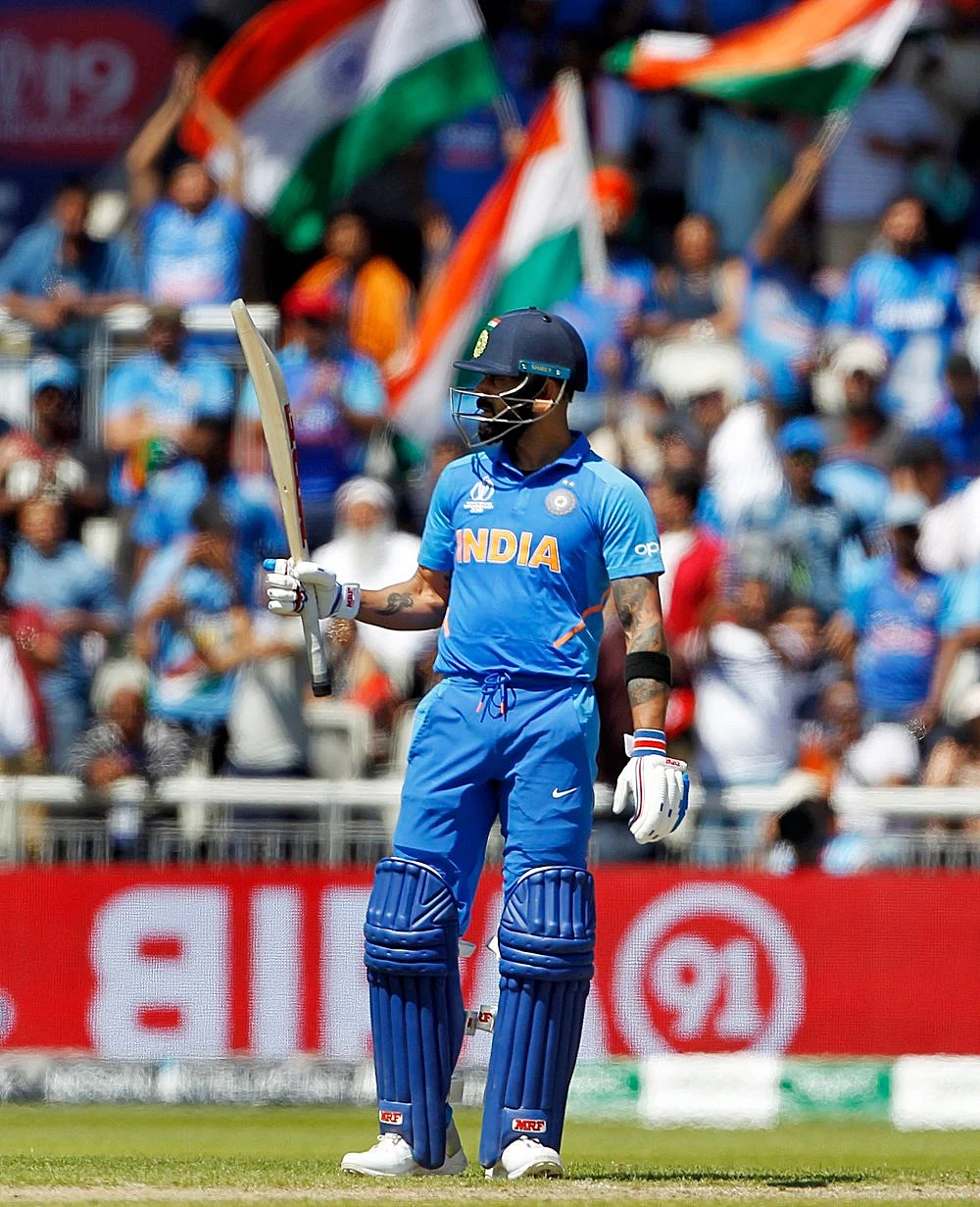 Indian batsman Virat Kohli celebrates his Half-Century during a match against West Indies in ICC CWC 2019 at Old Trafford in Manchester on Thursday.