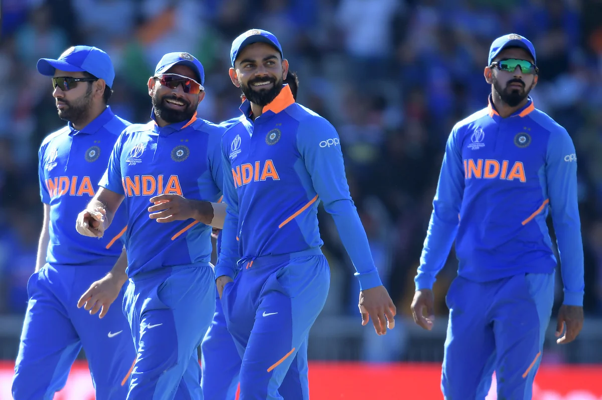India's captain Virat Kohli (C) and teammates gesture at end of play during the 2019 Cricket World Cup group stage match between West Indies and India.