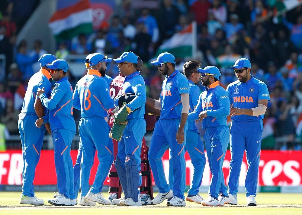 Indian players celebrate after winning the match against West Indies in ICC CWC 2019 at Old Trafford in Manchester on Thursday.