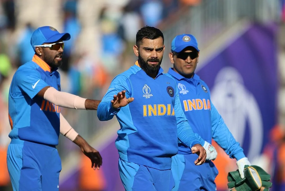 Indian skipper Virat Kohli with teammates