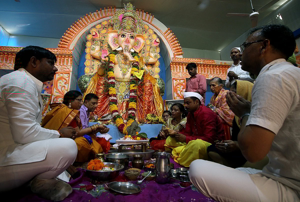 Devotees offering prayers after the installation of an idol of Lord Ganesh at Patrakarpuram Ganesh Puja Pandaal on the occasion of Ganesh Chaturthi in Lucknow 