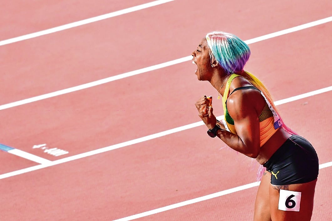 Mother’s day out: Set off on victory lap carrying her two-year-old son