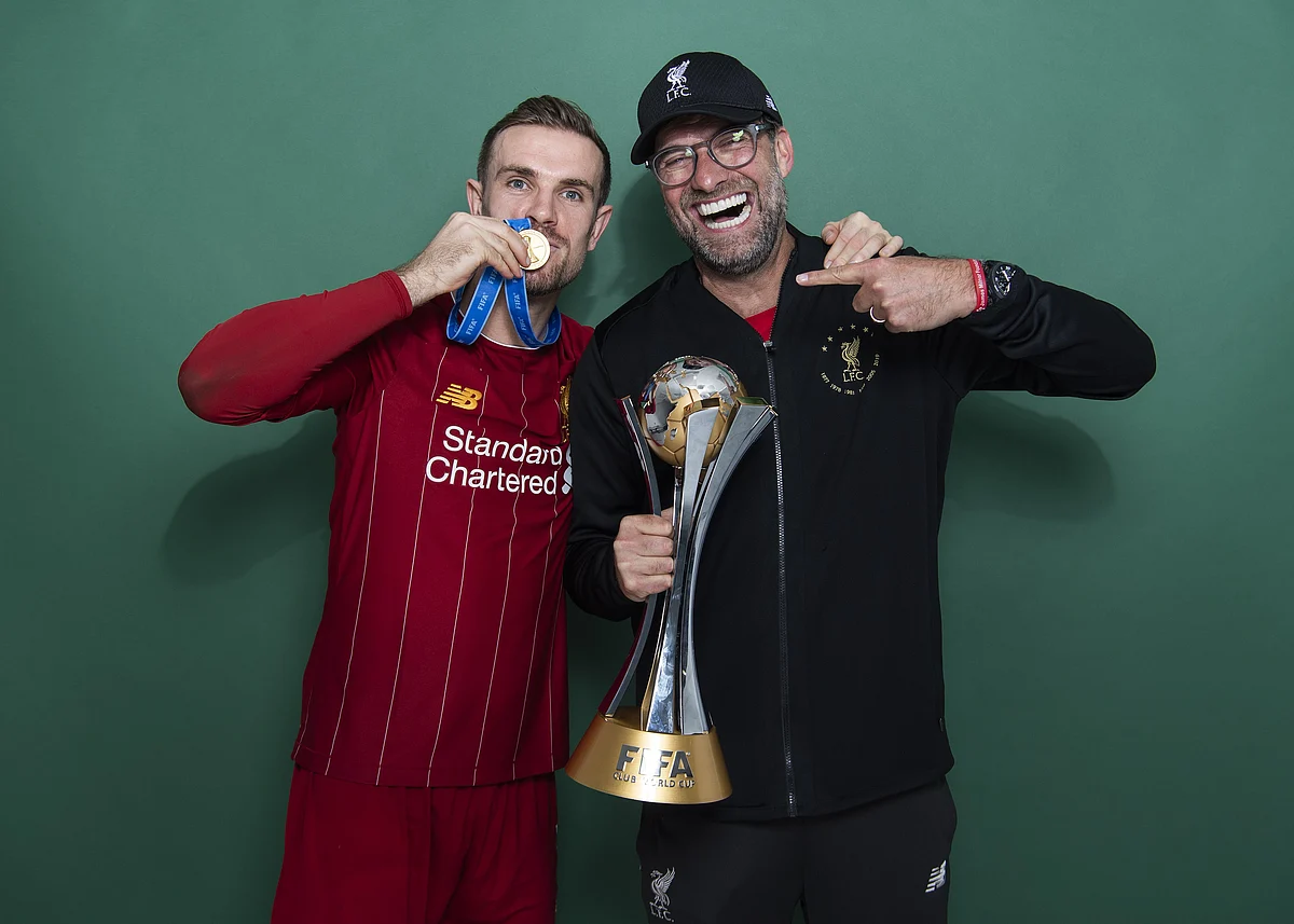 Liverpool manager Jurgen Klopp (right) with Jordan Henderson