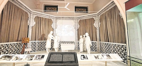 Exhibit of a scene of Dadasaheb Phalke's Raja Harishchandra and the film playing in the background