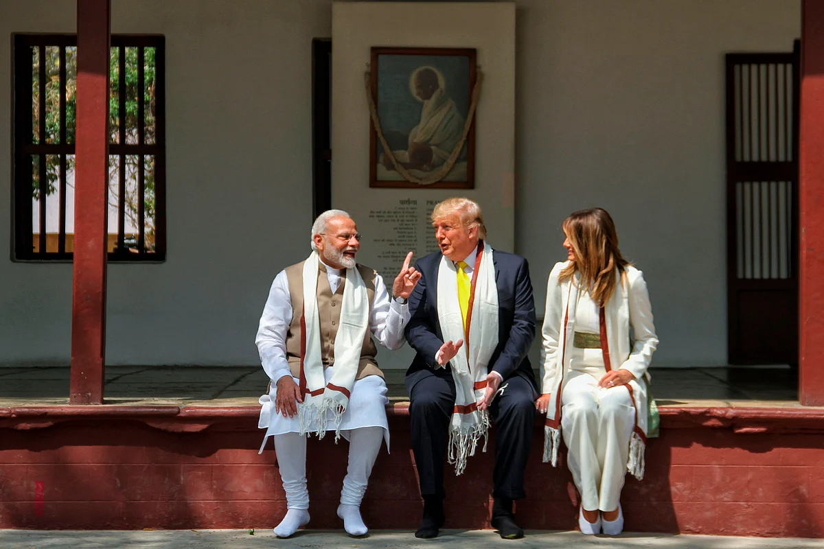 Photograph taken and released by India's Ministry of External Affairs (MEA) on February 24, 2020, US President Donald Trump and First Lady Melania Trump listen to India's Prime Minister Narendra Modi (L), during their visit at Gandhi Ashram in Ahmedabad.