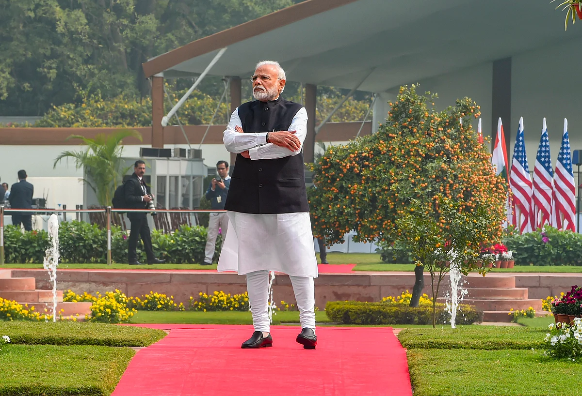 Prime Minister Narendra Modi waits for the arrival of U.S. President Donald Trump prior to a meeting, at the Hyderabad House, in New Delhi, Tuesday, Feb. 25, 2020.
