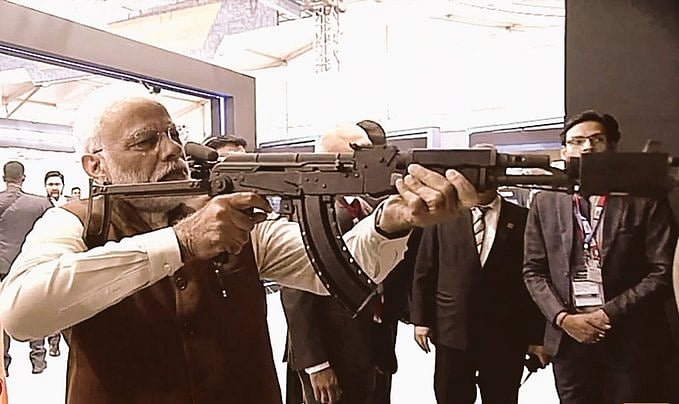 Prime Minister Narendra Modi at a virtual firing range on display at the Defence Expo