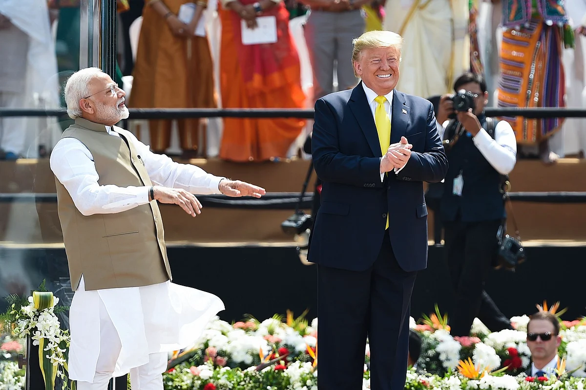 US President Donald Trump (R) and India's Prime Minister Narendra Modi greet the crowd during 'Namaste Trump' rally at Sardar Patel Stadium in Motera, on the outskirts of Ahmedabad, on February 24, 2020.