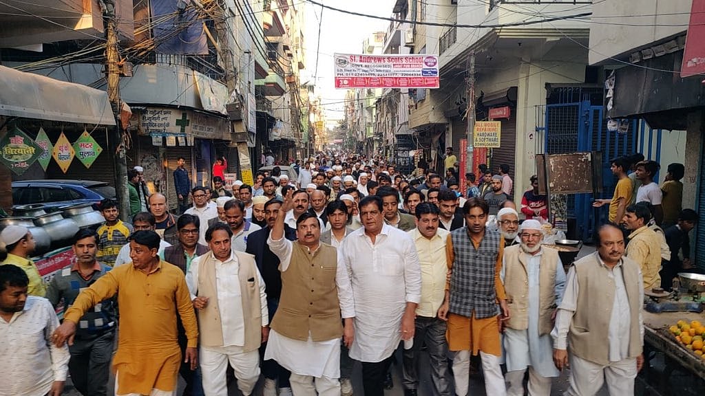 AAP leader Sanjay Singh leads a peace march in Gandhi Nagar.