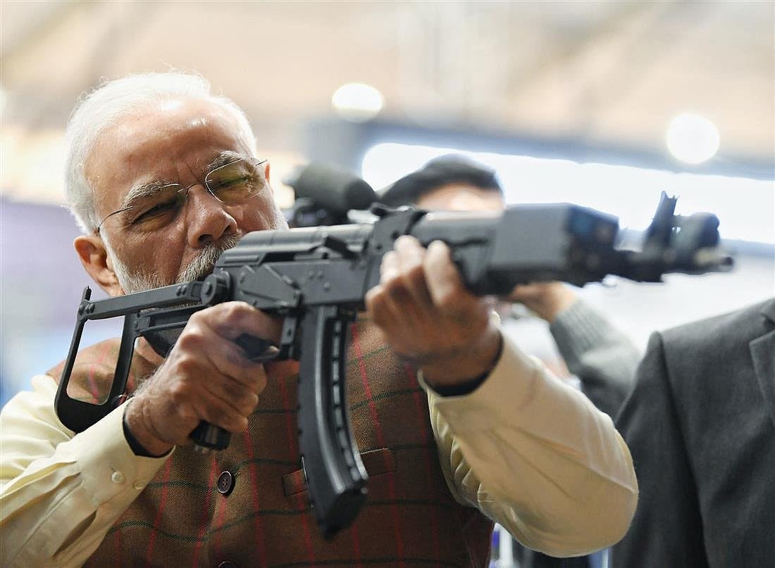 Prime Minister Narendra Modi at a virtual firing range on display at the Defence Expo