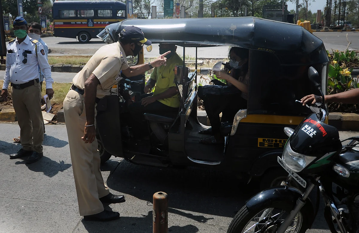 Mumbai police checks all the vehicles across the city during the lock down on Thursday.