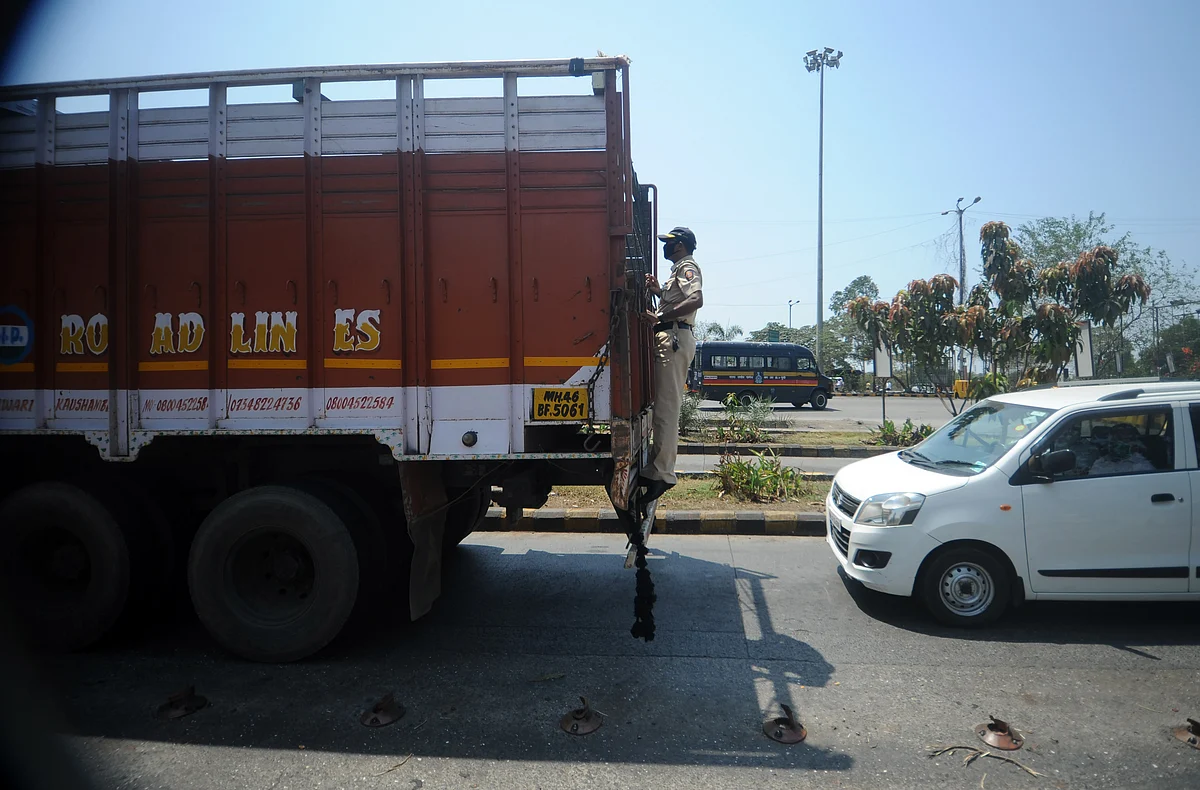 Mumbai police checks all the vehicles across the city during the lock down on Thursday.