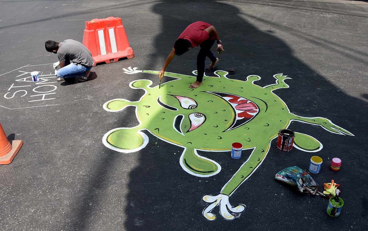 A man painting coronvirus' painting below Grant Road skywalk.