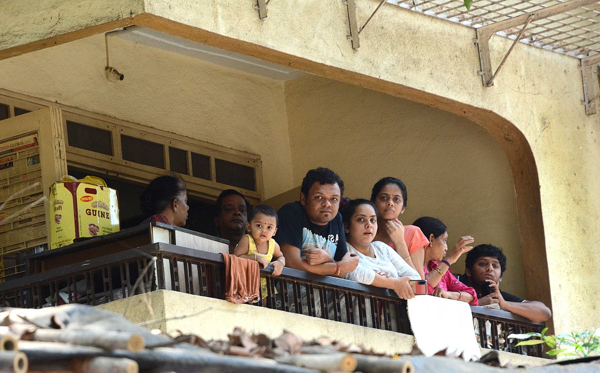 A family standing in their balcony in Goregaon amid lockdown. 