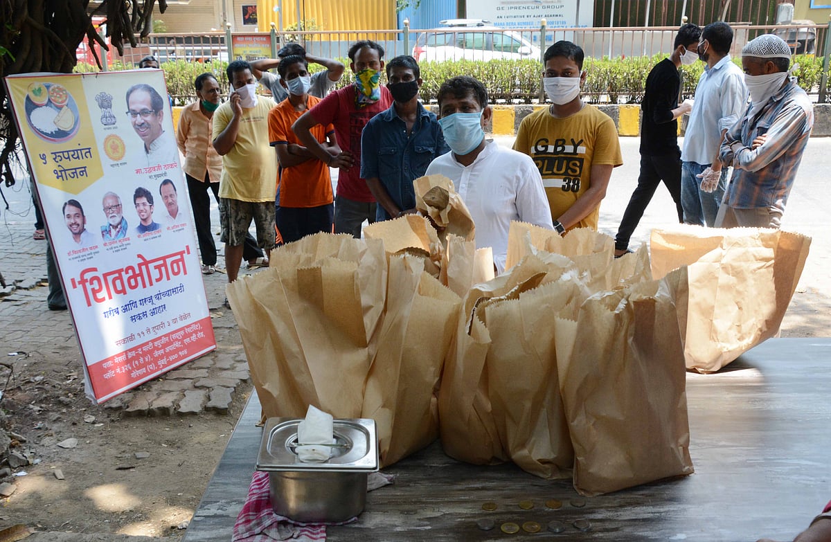 People standing in queue for meals under 'Shiv Bhojan' scheme.