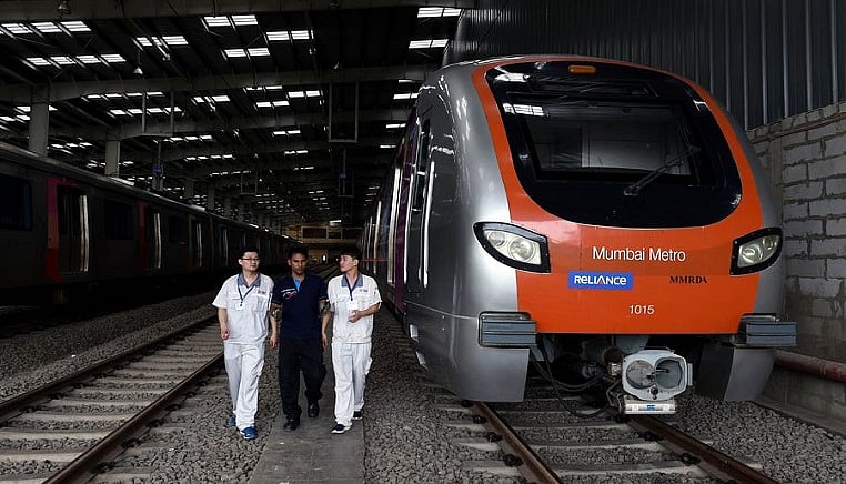 Chinese and Indian staff work at a metro car depot of Metro Line 1, in Mumbai, India, on June 27, 2018.