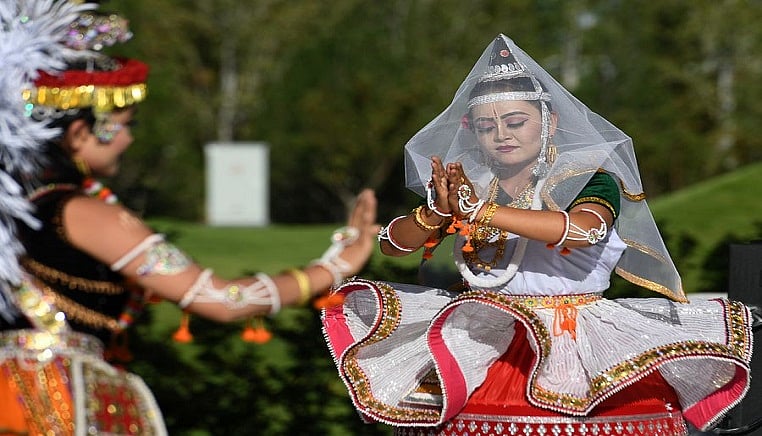 Staff members perform during the