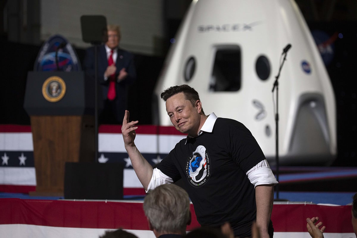 U.S. President Donald Trump acknowledges SpaceX founder Elon Musk (R) after the successful launch of the SpaceX Falcon 9 rocket