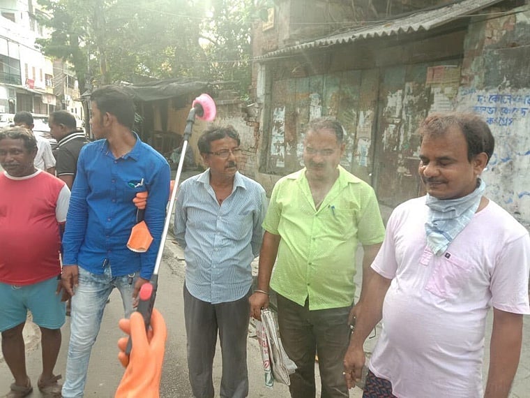 KMC spraying areas and even people with a liquid called Anion Detox along with distilled water