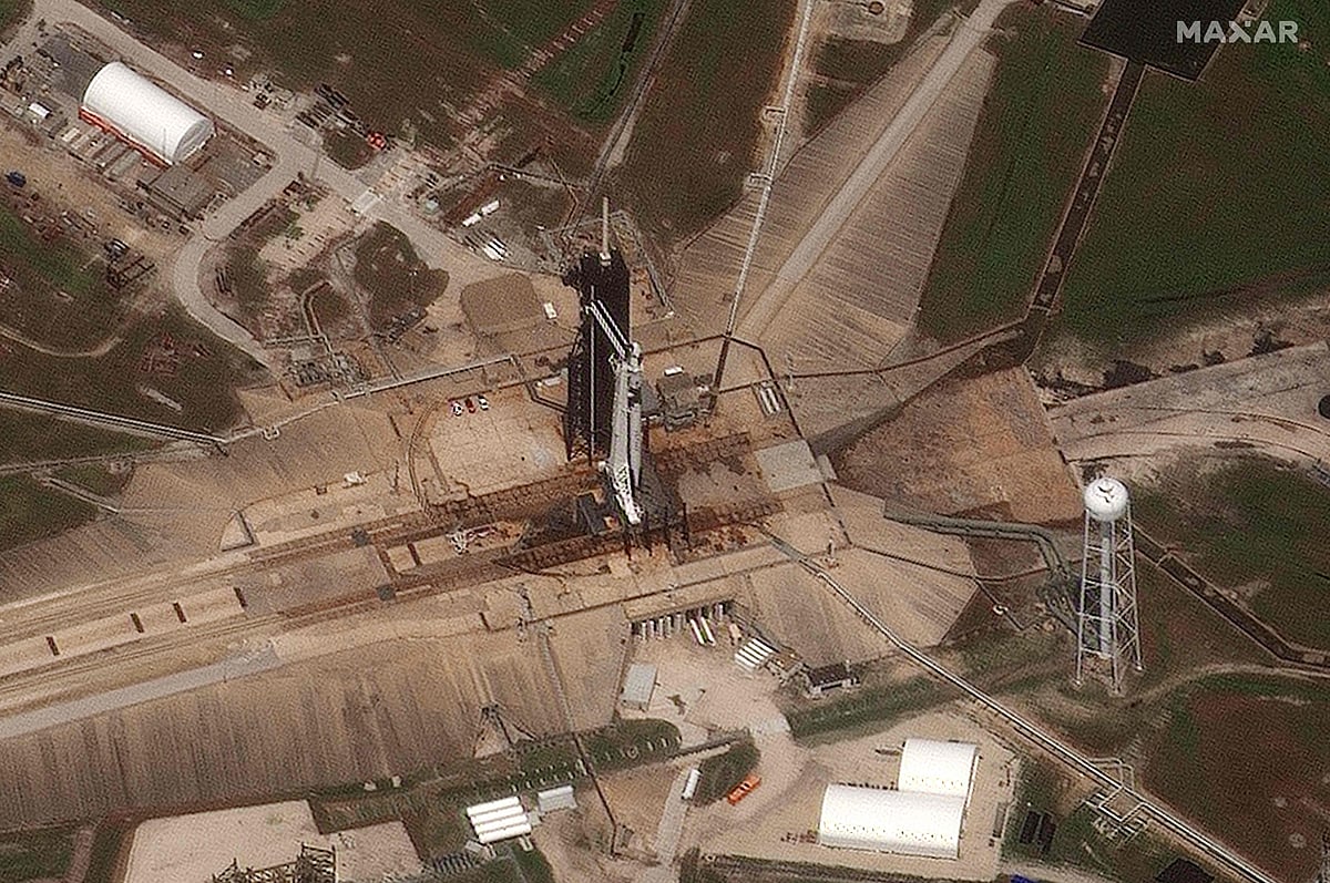 This handout satellite image released by Maxar Technologies shows a SpaceX Falcon 9 rocket carrying the Crew Dragon spacecraft on the launch complex 39A at the Kennedy Space Center in Florida on May 30, 2020