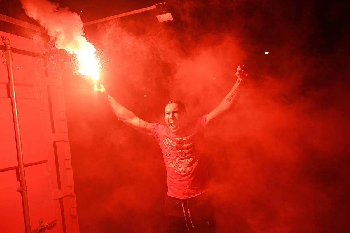 A Liverpool fan celebrating Red Devil's Premier League title win after 30-year drought.