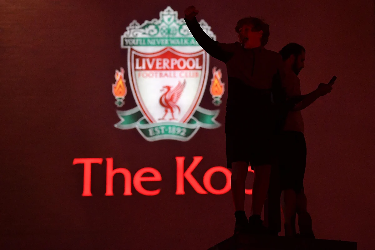 Fans celebrating Liverpool winning the Premier League title .