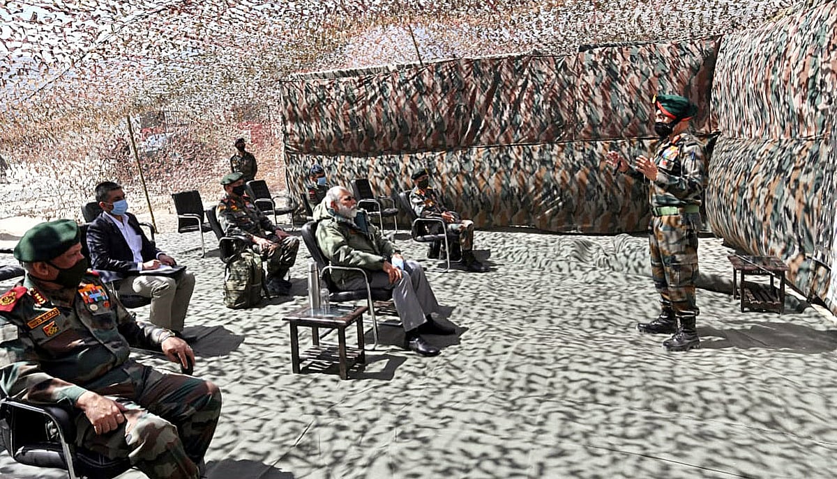 Prime Minister Narendra Modi makes a surprise visit to Ladakh, being briefed by senior officials at a forward position in Nimu on Friday.