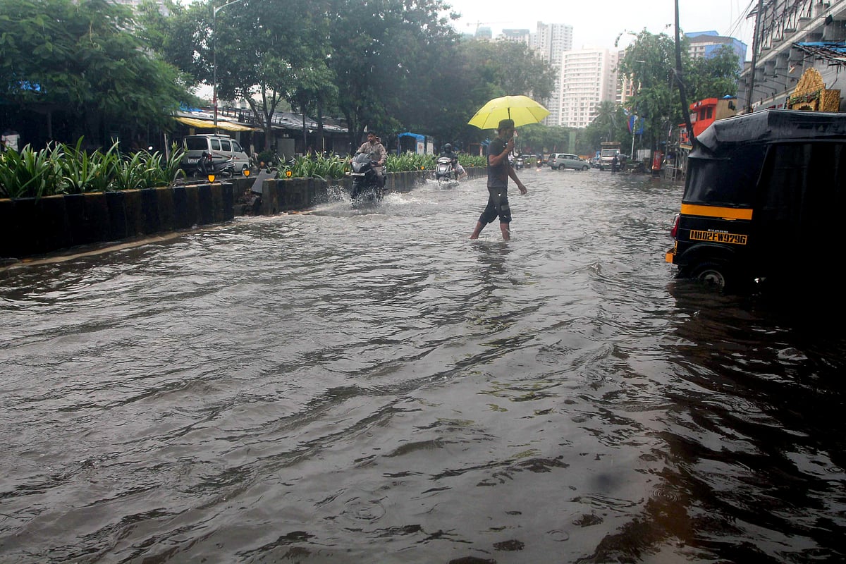A view of the waterlogged road following heavy rainfall at S.V Road, Jogeshwari in Mumbai on Sunday.