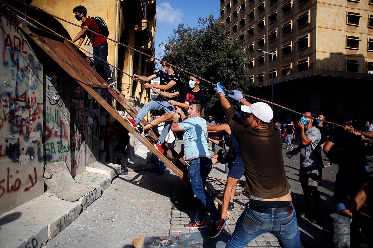 Beirut: Demonstrators clash with police during a protest against the political elites and the government after this weeks deadly explosion at Beirut port which devastated large parts of the capital in Beirut, Lebanon, Saturday, Aug. 8, 2020