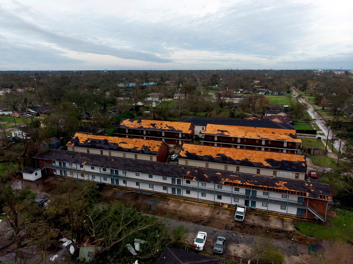 This aerial view shows damage caused by Hurricane Laura to the roof of an apartment complex on August 27, 2020 in Lake Charles, Louisiana.