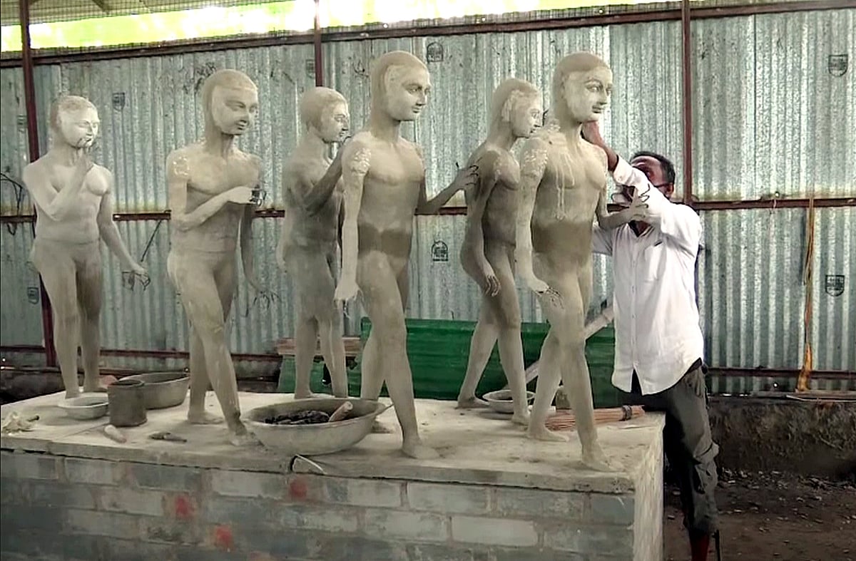 A worker preparing the design of the statues at the Ram temple site, in Ayodhya