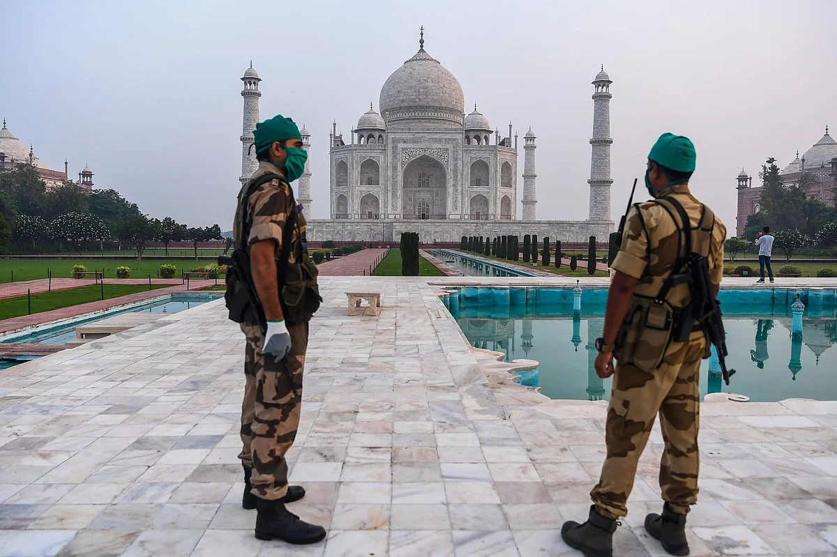 Security personnels patrols at the Taj Mahal in Agra on September 21, 2020. - The Taj Mahal reopens to visitors on September 21 in a symbolic business-as-usual gesture, even as India looks set to overtake the US as the global leader in coronavirus infections.