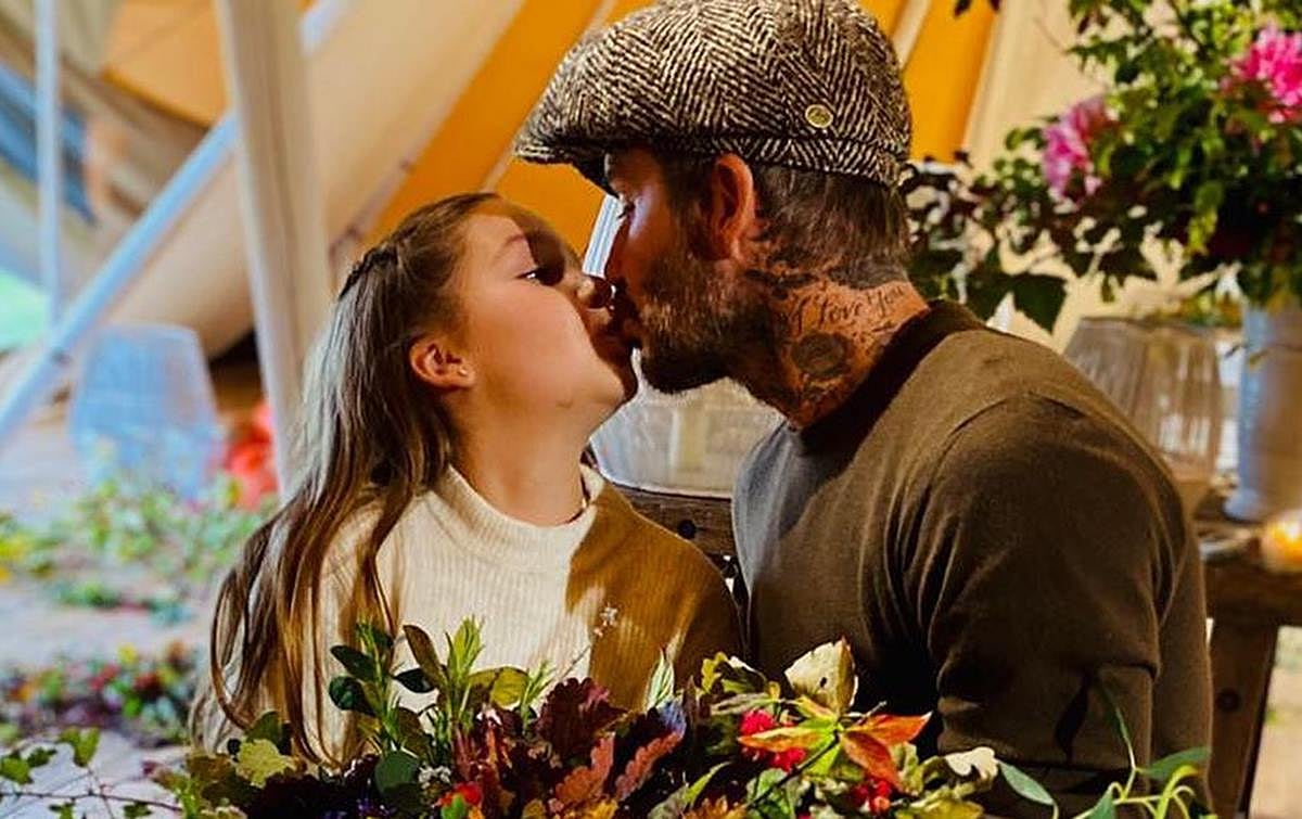 David Beckham fans divided over him kissing 9-year-old daughter Harper on the lips