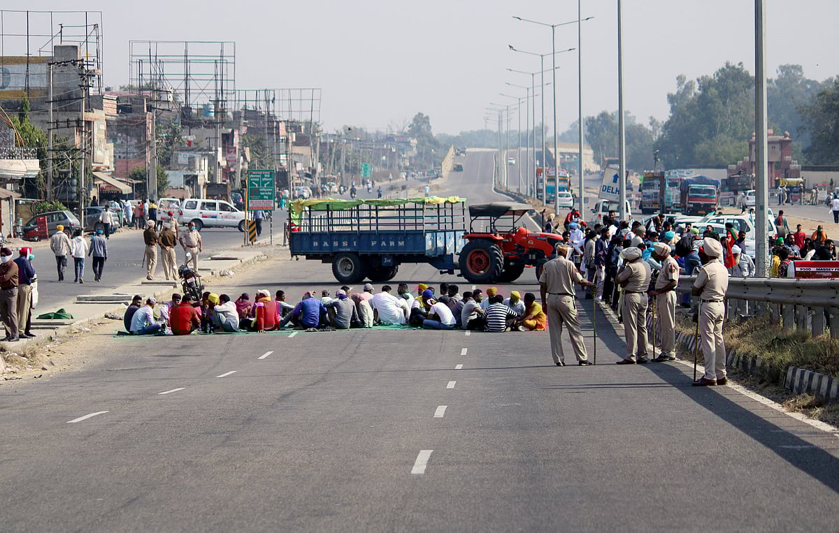 Farmers block Amritsar-Delhi National Highway during their four hours statewide Chakka Jam, near Jalandhar