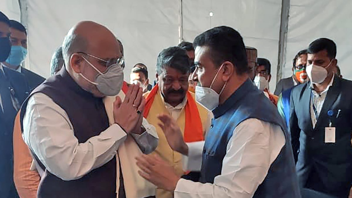 Suvendu Adhikari felicitates Home Minister Amit Shah during a public rally, at Midnapore College Ground, in Midnapore on Saturday