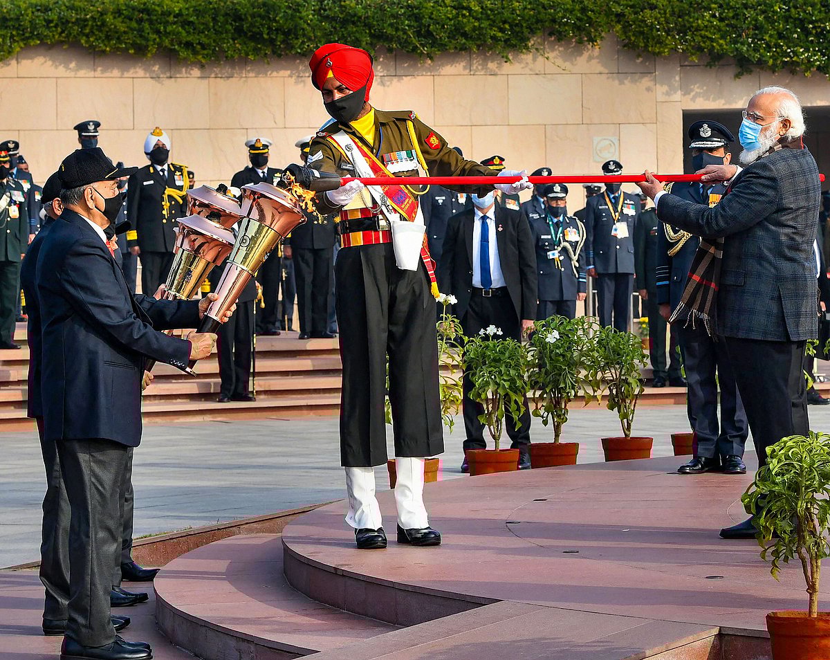 Prime Minister Narendra Modi lights the