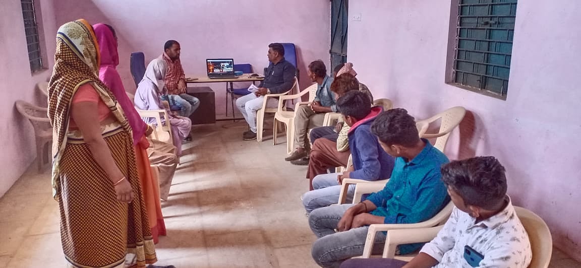 Villagers listening listening Prime Minister Narendra Modi through video-conferencing