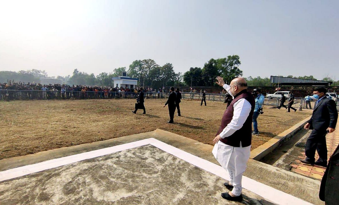 Union Home Minister Amit Shah waves to supporters as he arrived in Midnapore on Saturday.