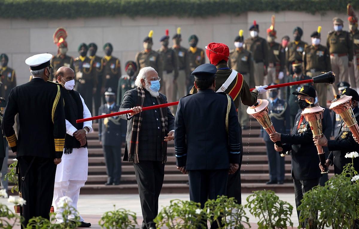 Prime Minister Narendra Modi lights the