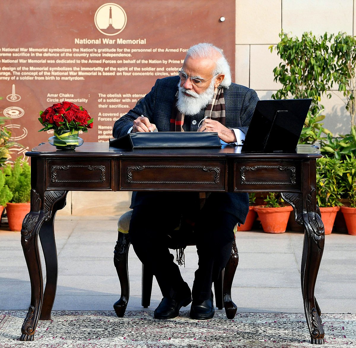 Prime Minister Narendra Modi signing the visitors book at the National War Memorial