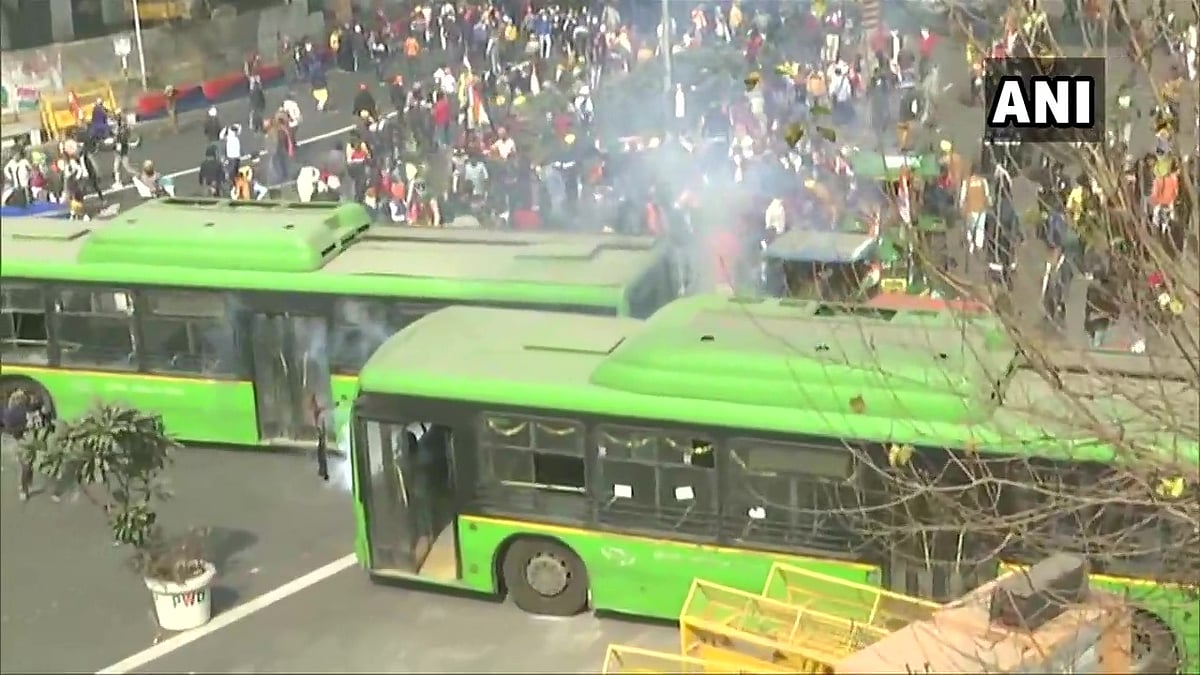Police use tear gas shells to disperse the protesting farmers at ITO in central Delhi