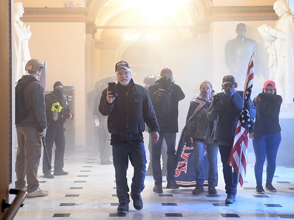 Mob of Donald Trump supporters storm US Capitol Building, one shot dead