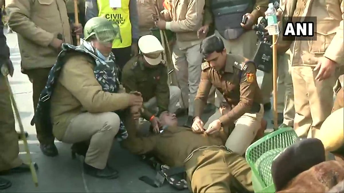A Delhi Police personnel was looked after by other Police personnel as he fell unconscious while on duty at Dilshad Garden, during the farmers' protest